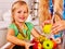 Children washing fruit at kitchen