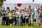 Children watching the battle of two teams. Young fans at sportive competition.