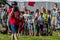 Children watching the battle of two teams. Young fans at sportive competition.