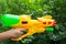 Children water gun in children\'s hand