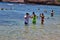 Children wearing snorkling gear, Hanauma Bay beaches, Hawaii.