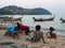 Children were waiting for his father at the beach. a Local Fisherman Village. Naiyang Beach, Phuket City, Thailand. May