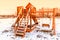 Children wood playground in park winter