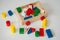 Children wooden trolley with colorful wooden cubes, cylinders an