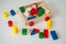 Children wooden trolley with colorful wooden cubes, cylinders an