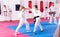 Children working in pair mastering new karate moves