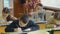 Children write sitting at a desk