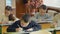 Children write sitting at a desk