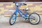 Childrens bicycle on brick wall background