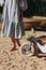 childrens bike with a basket and a woman in a blue dress on the sand