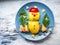 Childrens breakfast with a snowman made of potatoes, small pieces of canned pink salmon on a blue plate
