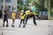 Childrens competition in roller sport.The girl jumps on rollers through a barbell