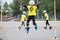 Childrens competition in roller sport.The girl jumps on rollers through a barbell