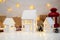 Childrens crafts made of white paper for Christmas, New Year. The decor of the houses is made of cardboard and garlands