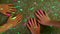 Childrens hands play together with the colorful glowing laser dots