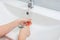 Childrens hands wash toothbrush after brushing their teeth