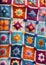 Childrens Illustration Of Handmade Colorful Patchwork: A Close-Up Of A Knitted Blanket With Vibrant, Handcrafted Pa. Generative AI