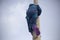 Childrens mountain climbing. A girl climbs on a pole. A child with insurance climbs a tall pole.