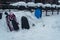 Childrens plastic sledges waiting outside a cafe in the snow