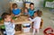 Childrens and their teacher at Kindergarten in classroom 