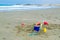 Childrens toys laying on the beach