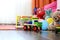 Childrenâ€™s multicolored toys on wooden floor or carpet on kids room