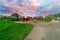 Childrenâ€™s park playground in Suburban Melbourne Victoria Australia. Lovely green grass and nice sunset colours in the sky