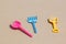 Childrenâ€™s toys - spoon, fork and spade on sand beach