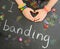 Childs hands forming a heart with loom band bracel