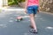 A childs legs and a skateboard, a close-up. A sport lifestyle