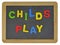 Childs play in colored letters on slate