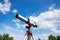 childs telescope pointed at the bright daytime sky