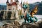 a childs toy dragon placed next to a castle model
