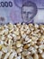 Chile, maize producing country, dry corn grains and chilean banknote of 2000 pesos