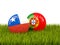 Chile and Portugal soccer balls on grass