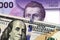 A Chilean 2000 peso bank note with an American one hundred dollar bill