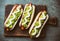 Chilean Completo Italiano. Hot dog sandwiches with tomato, avocado and mayonnaise on wooden board. Top view.