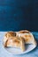 Chilean empanadas, made with meat and onion. Blue background.