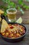 Chili con carne in a pan with nachos