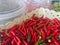 Chili grained red organic basket, Pile of red chili smaller lots