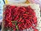 Chili grained red organic basket, Pile of red chili smaller lots and garlic grained