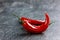 Chili pepper on a black stone background