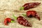 Chili pepper on wooden background.Extra hot chili pepper Naga Bhut Jolokia Chocolate.Raw food. Sale Chili