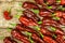 Chili pepper on wooden background.Extra hot chili pepper Naga Bhut Jolokia Chocolate.Raw food. Sale Chili