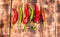 Chili peppers on wooden background. Red and green chile peppers. Organic chillies.