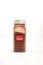 Chili powder in spice condiment glass bottle with label isolated in white background.