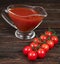 Chili tomatoes and tomato on wooden background