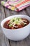 Chili topped with cheese and green onion