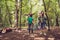 Chill, fun, joy, love and friendship! Four friends are fooling around in a wood at a campground, boys piggyback their ladies. Beau