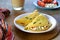 Chilla, tortillas or pancakes made from chickpea flour stuffed with cheese panir and tomato on a white plate